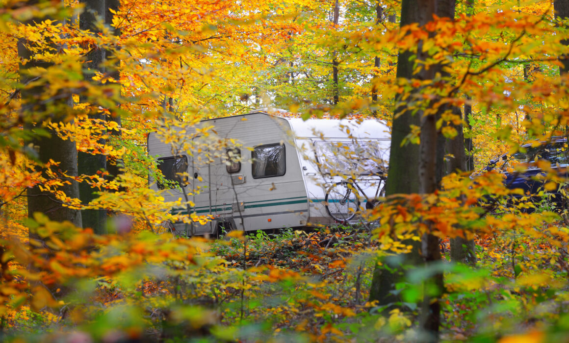 Caravan,Trailer,With,A,Bicycle,And,A,Car,Parked,In